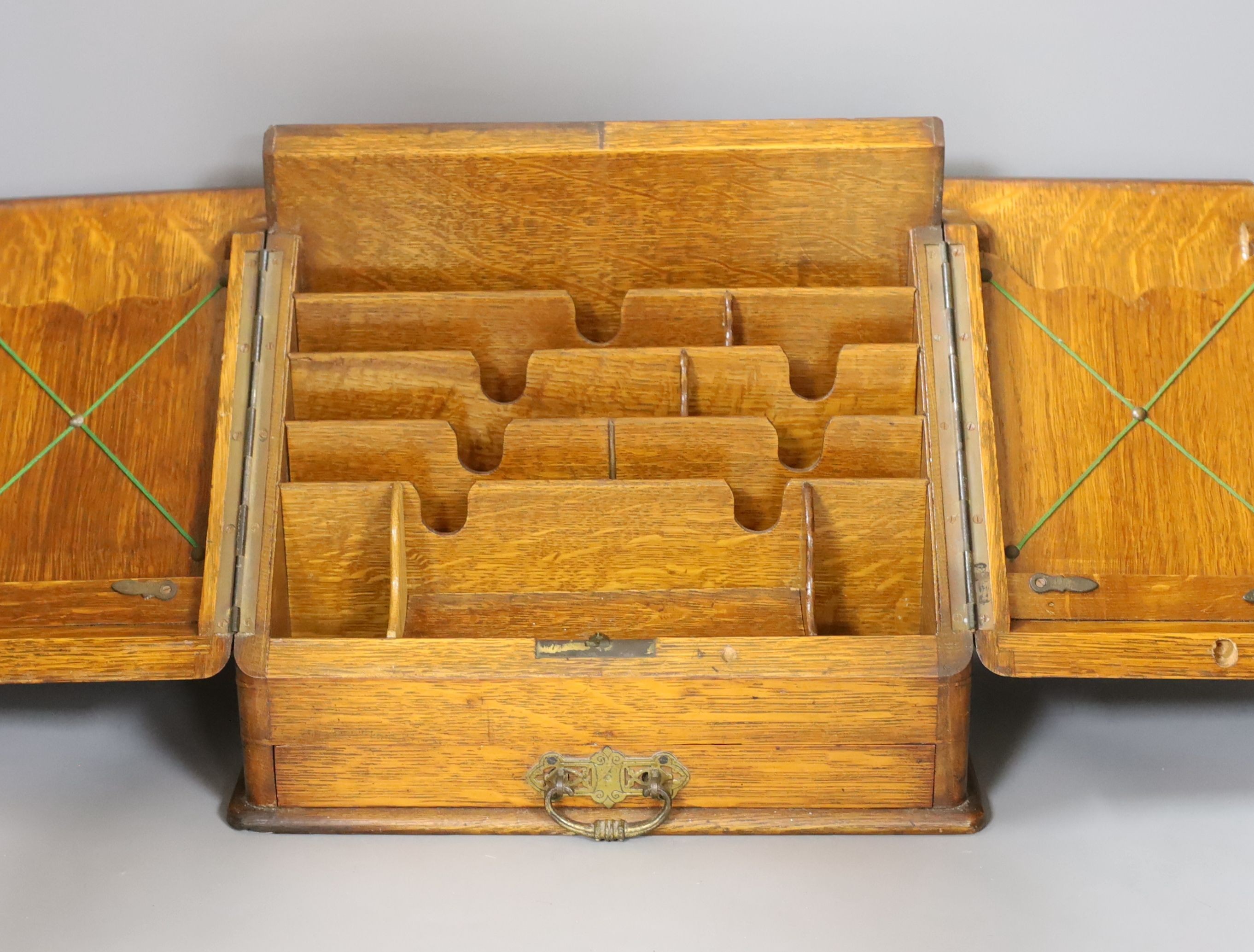 A late Victorian oak stationary box, 30 cms high.